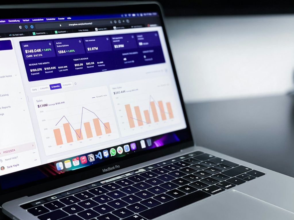 Laptop displaying a performance analytics dashboard used to review business operations