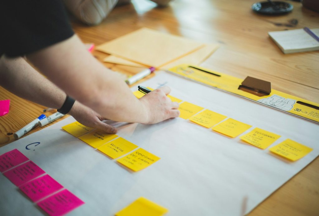 Marketer sketching a content strategy plan on paper at a desk