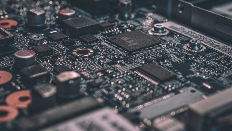 Macro view of a dark circuit board, representing the technical upkeep behind a well-maintained website